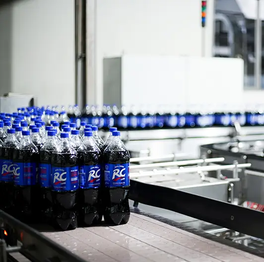 RC Cola carousel conveyor turning during production