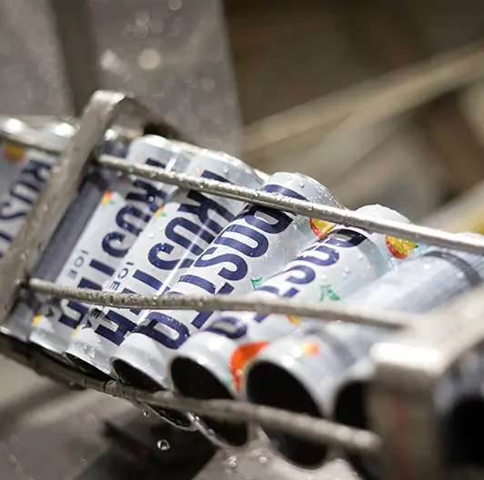 Close-up of Frostea Energy cans packed for shipping